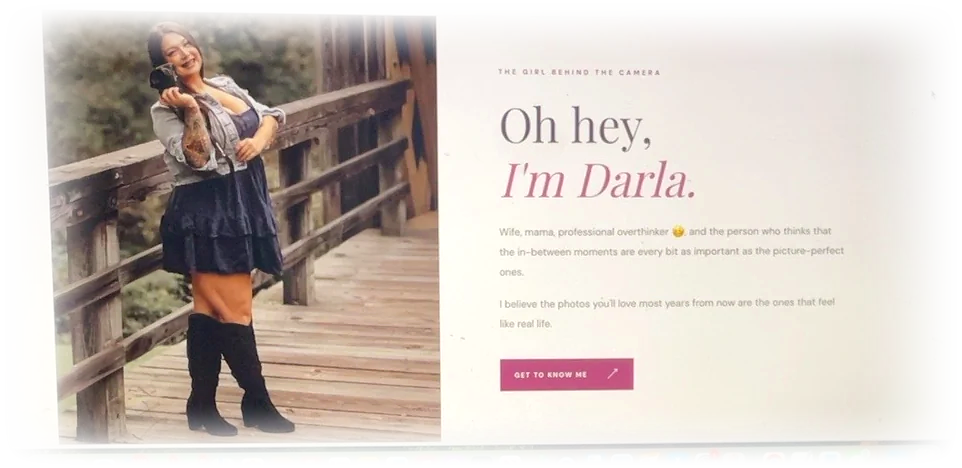 Actual Meet Darla About page screenshot with Darla holding her camera on a wooden bridge